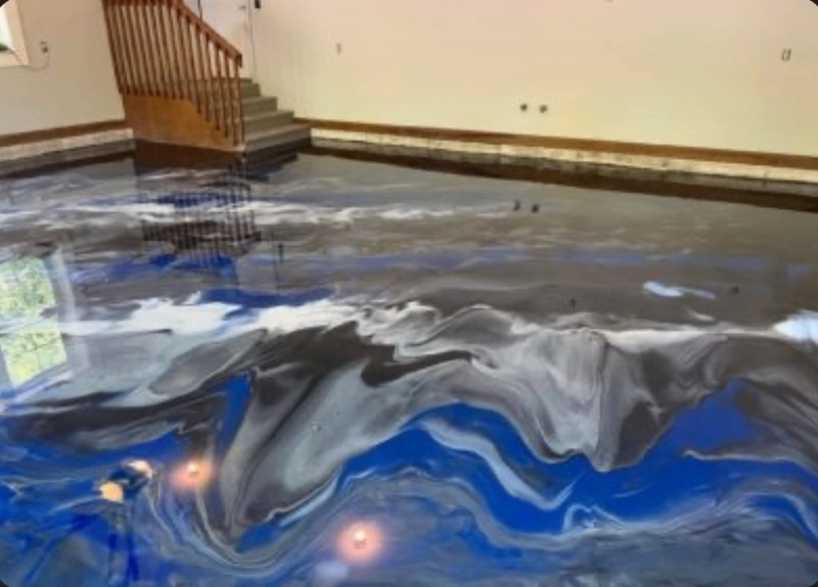 Blue and silver metallic epoxy floor poured in a Virginia home