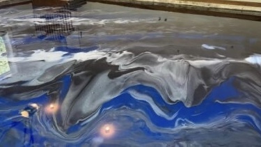 Blue, silver and black metallic epoxy floor installed by Elite Epoxy Solutions